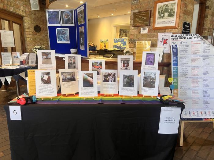 Stall on inclusive methods of involvement, displaying community stories, research materials and resources at the NIHR ARC East of England launch event
